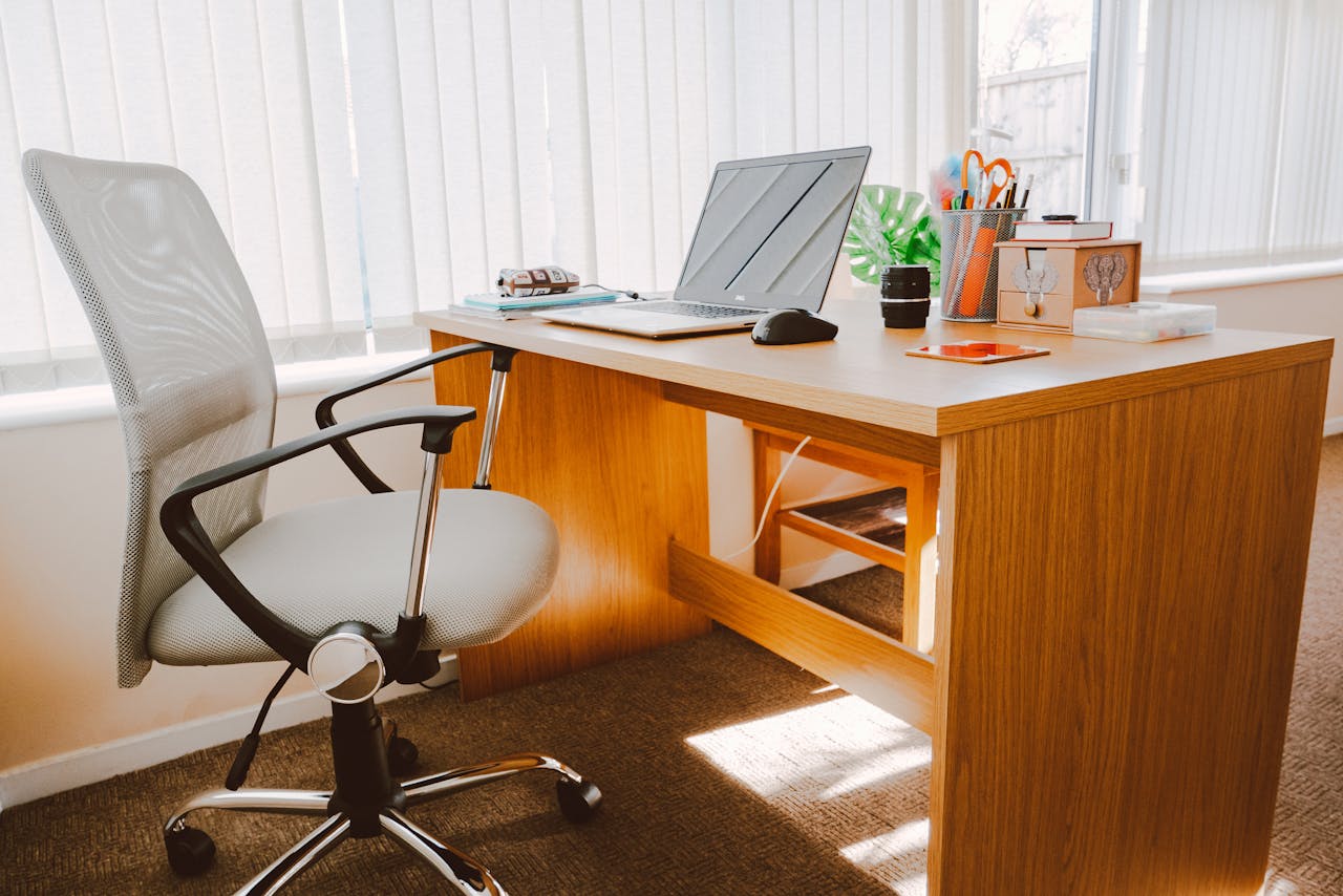 A bright, furnished workspace with natural light